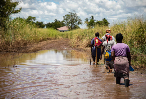 women walking through water