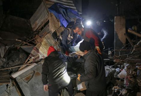 Volunteers work through the night to rescue a woman who was trapped for over 30 hours in Hatay, Turkey