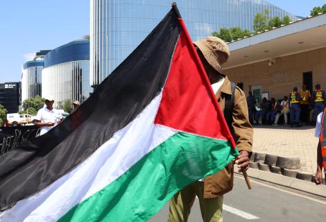 Man holds Palestine flag in solidarity